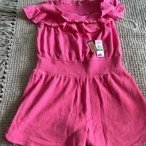 Vineyard vines short romper can be worn off shoulder or on shoulder.